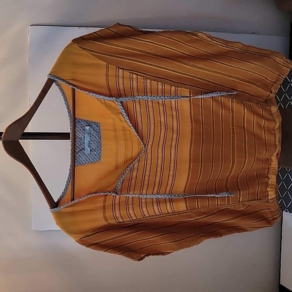 Stripey orange top. Yoga, but I definitely get a beach vibe.
